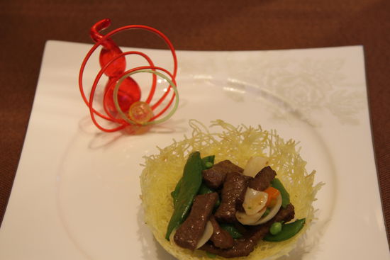 雀巢爆羊柳。 花惠生 供圖